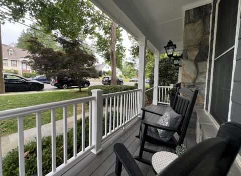 Renovated Arlington front porch with TimberTech decking and white composite railing
